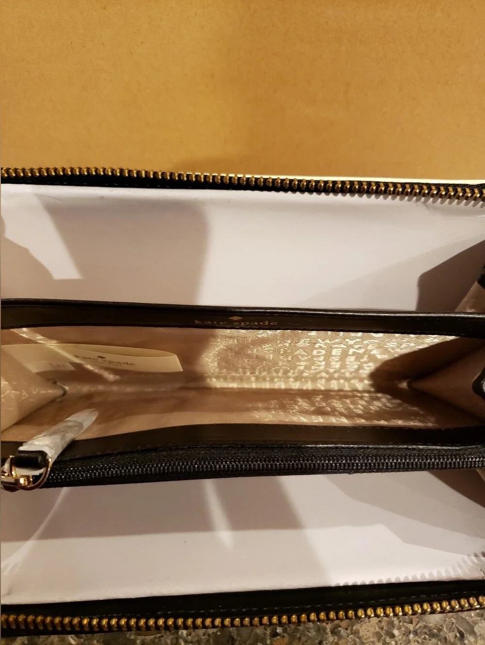Kate spade Black and Cream Patent Stripe Zip Wallet.